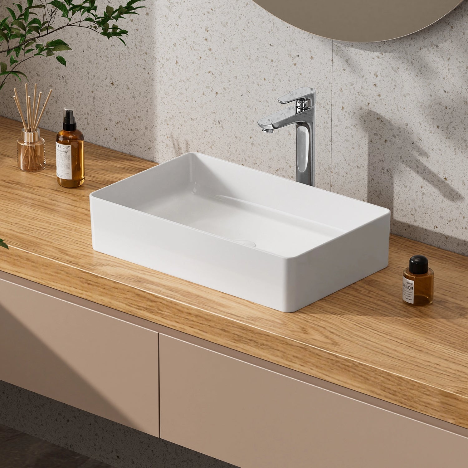 The JOMOO ceramic vessel sink offers a modern rectangular design with a high-quality ceramic finish. It is easy to clean and features a sleek chrome faucet. This stylish sink is perfect for enhancing the look of any bathroom.
