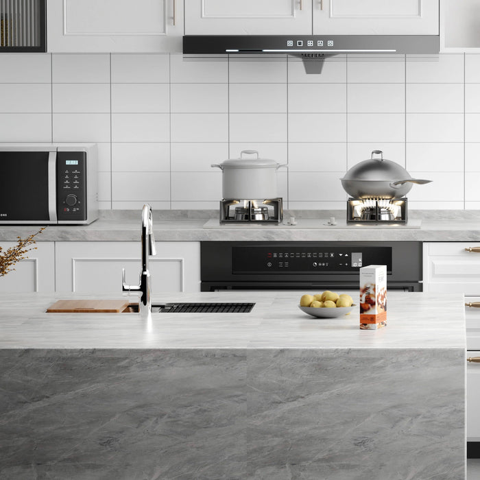 A matte-black JOMOO pull-down faucet crowns a quartz-topped island sink, flanked by minimal cabinetry and soft pendant lighting.