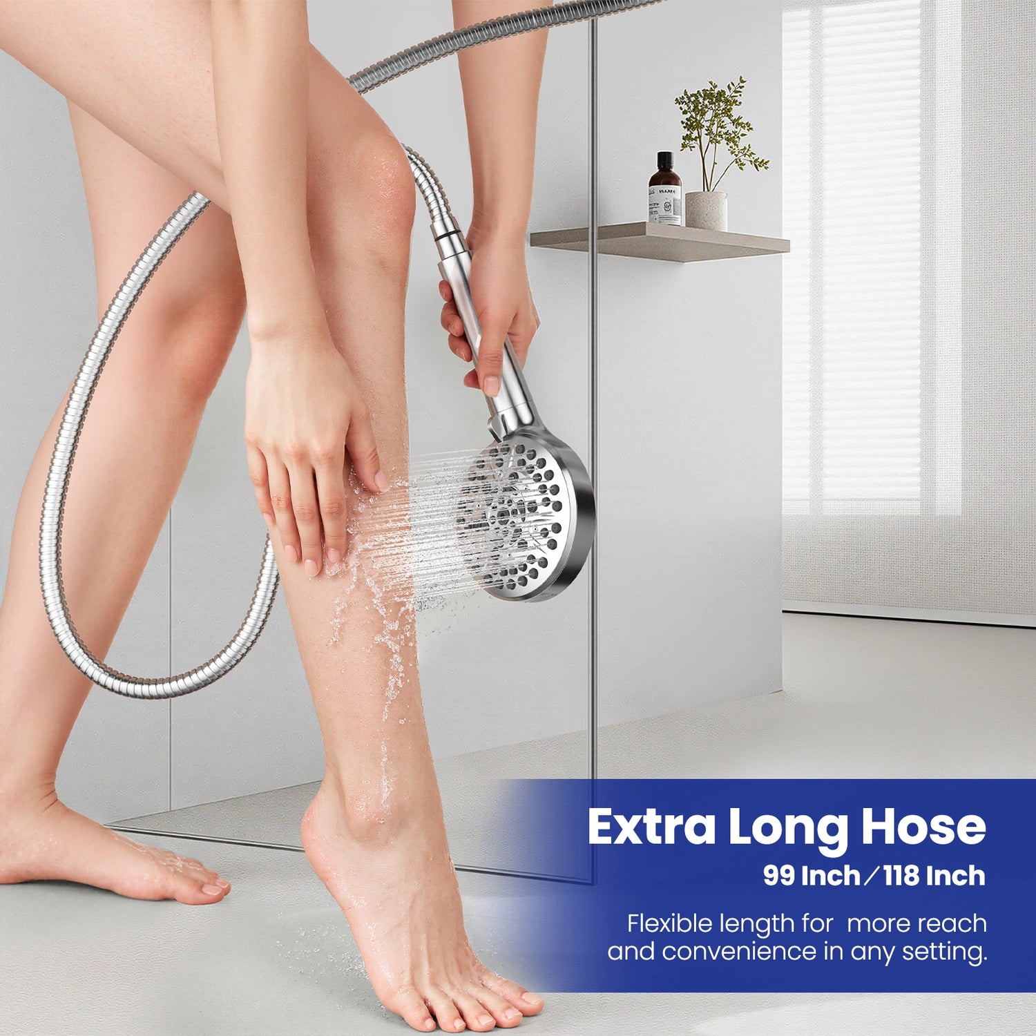 A person using the JOMOO extra-long shower hose to rinse legs, demonstrating its reach and flexibility. The 99-inch stainless steel hose ensures convenience with consistent water flow in any bathroom setting.